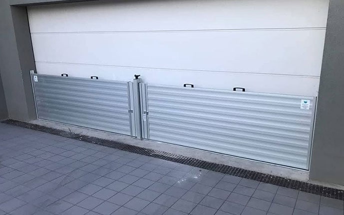 Steel flood barriers Australia against garage doors