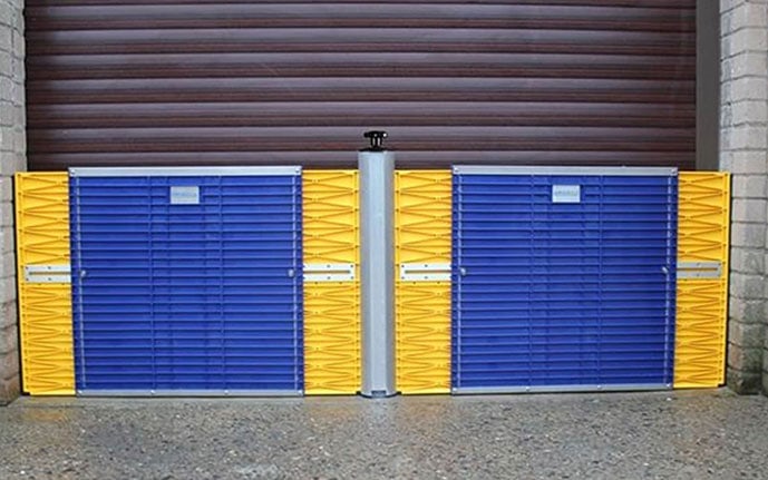 Blue and yellow flood barriers Australia