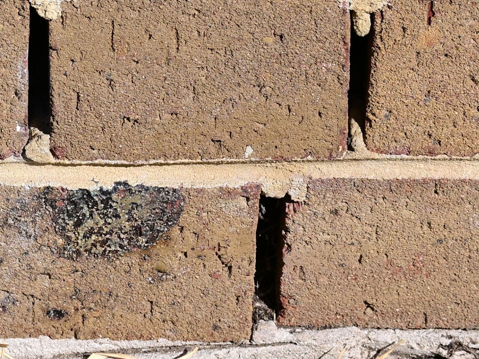 Brick wall weep holes that can be fitted with flood protection vents to reduce water ingress